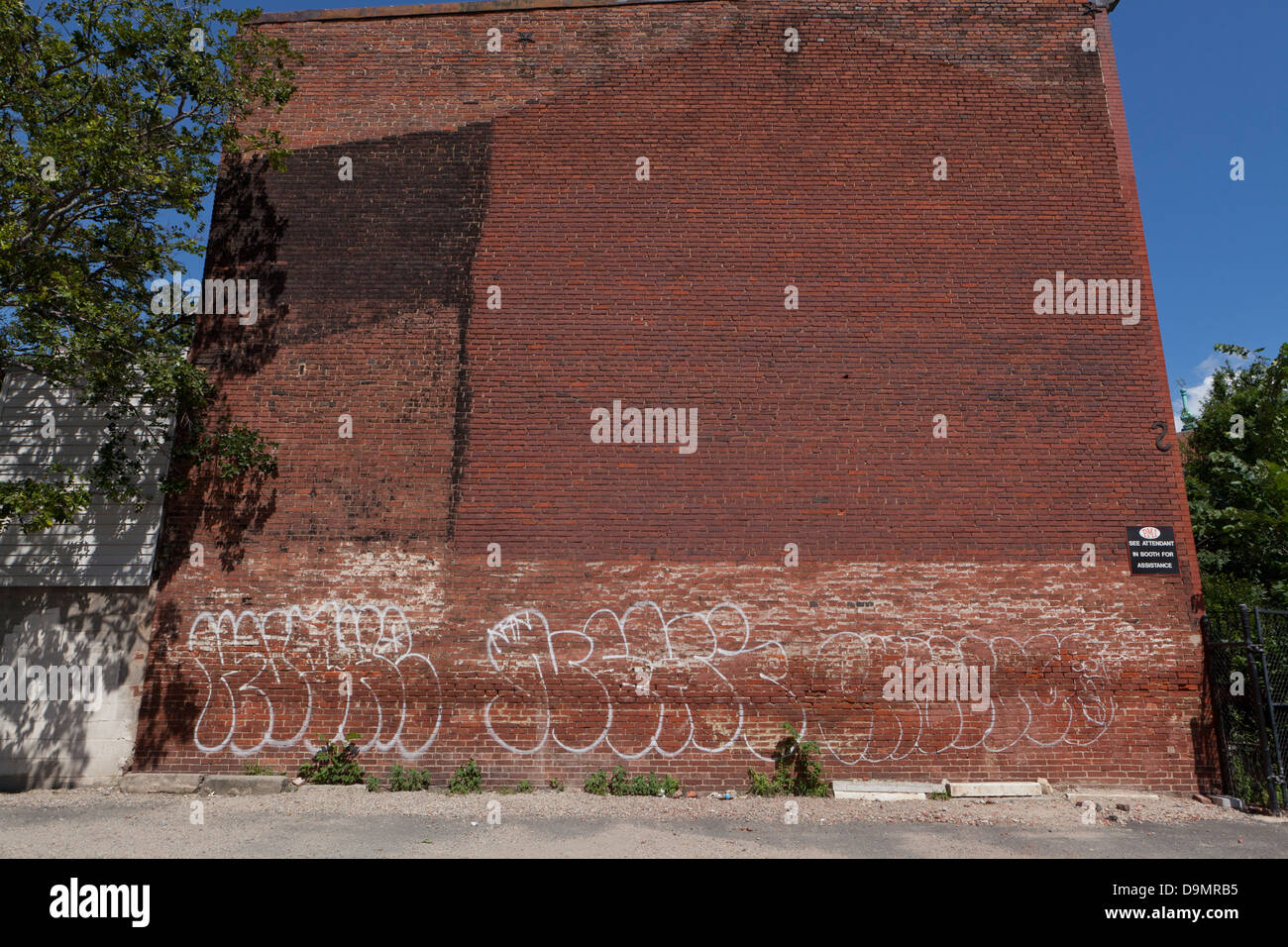 Graffiti on side of brick building - USA Stock Photo