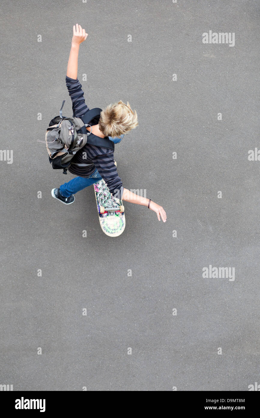 overhead view of teen boy skateboarding Stock Photo