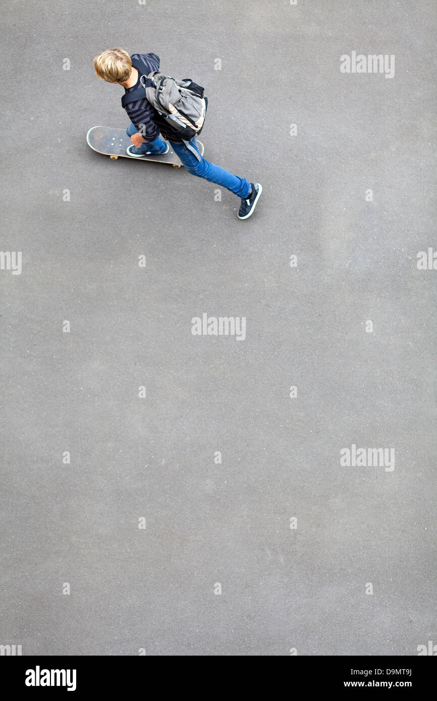 above view of a teen boy skateboarding Stock Photo