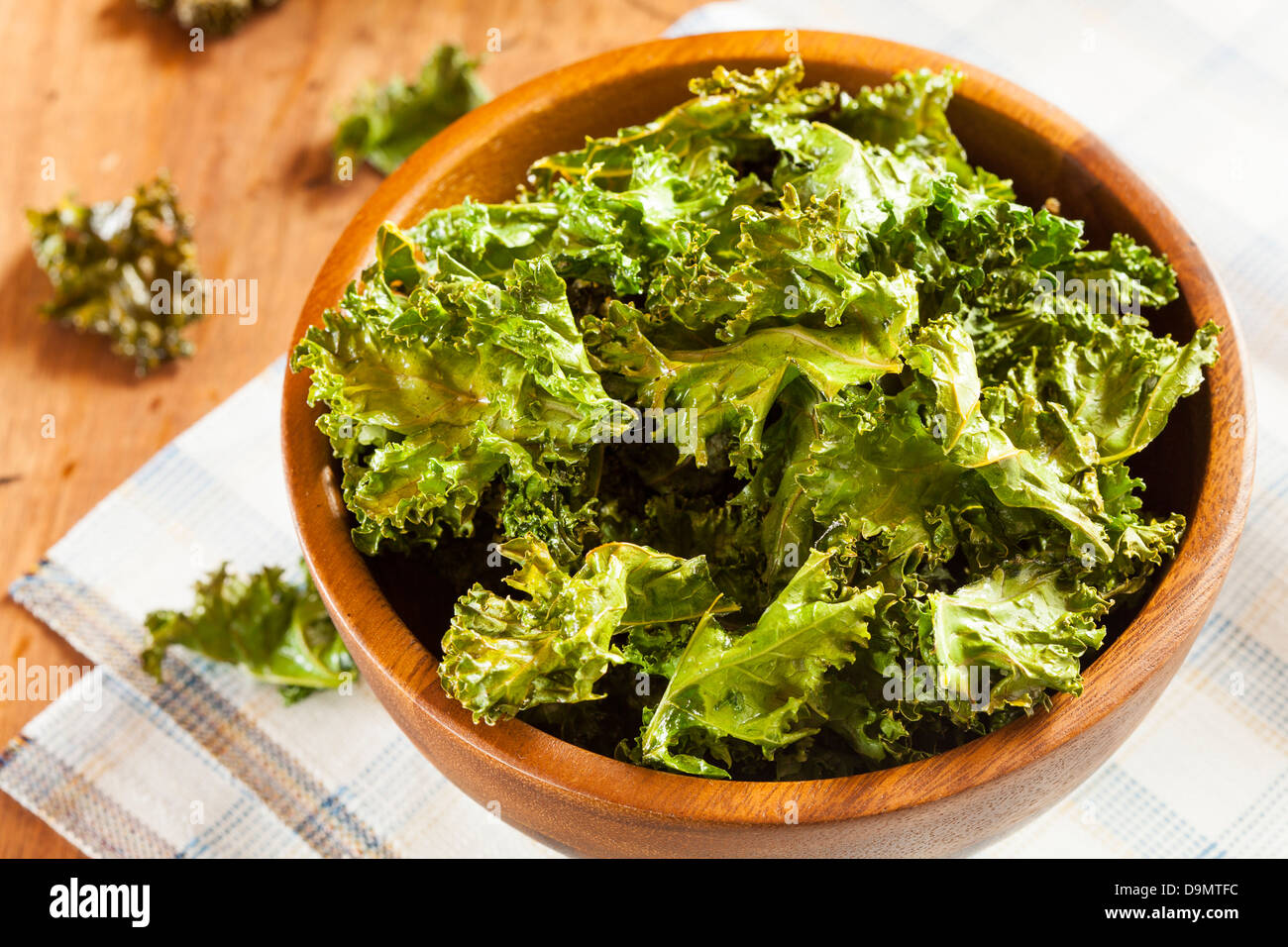 Homemade Organic Green Kale Chips with salt and oil Stock Photo