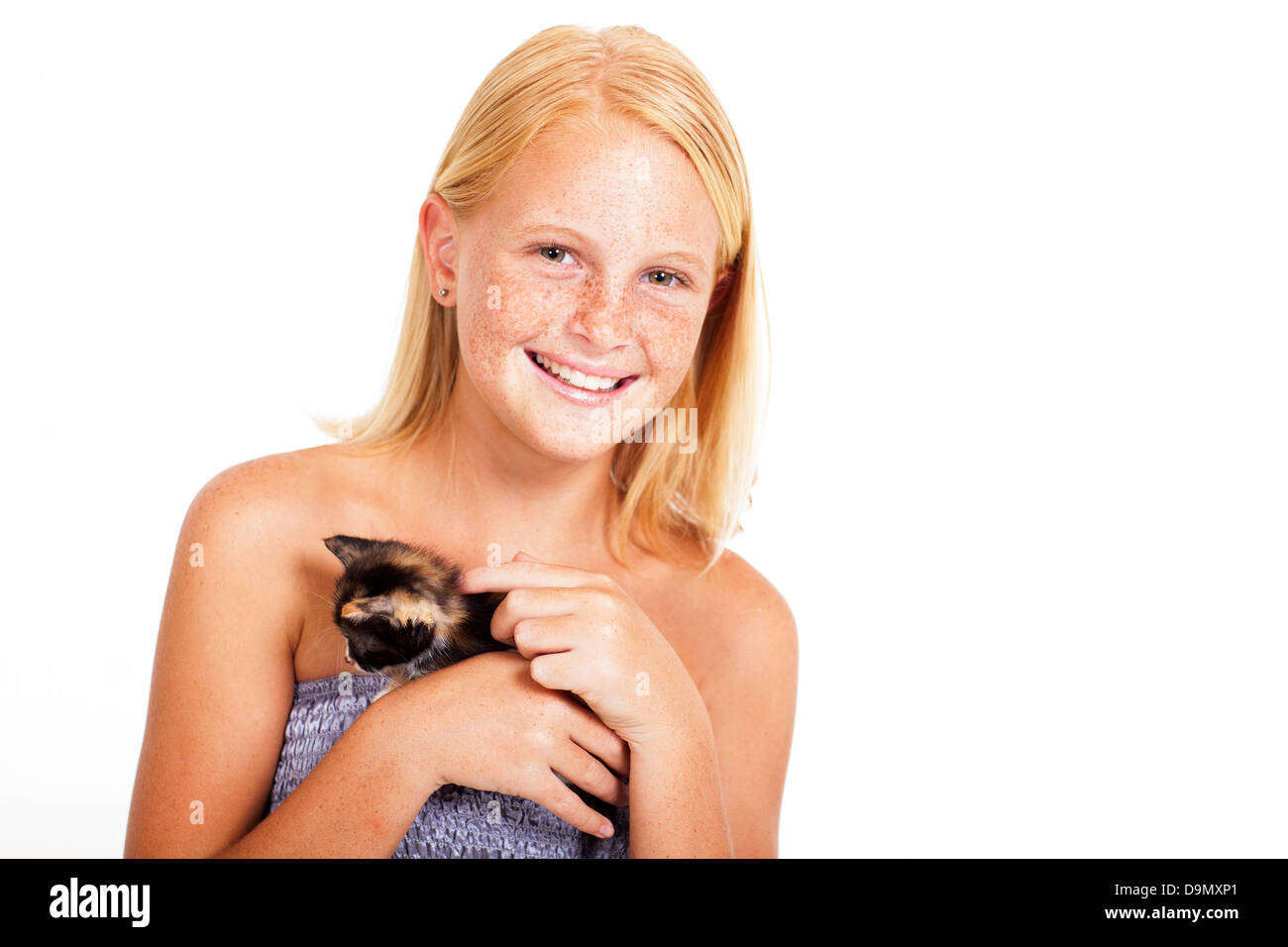 cute little girl with freckles holding a kitten Stock Photo