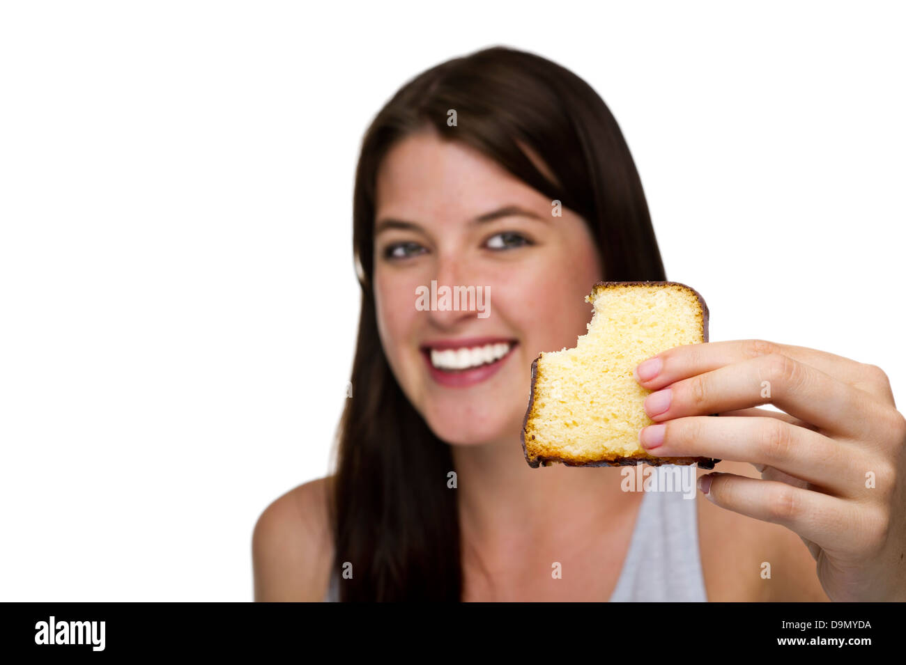(Model release) Woman likes with pleasure cake Stock Photo