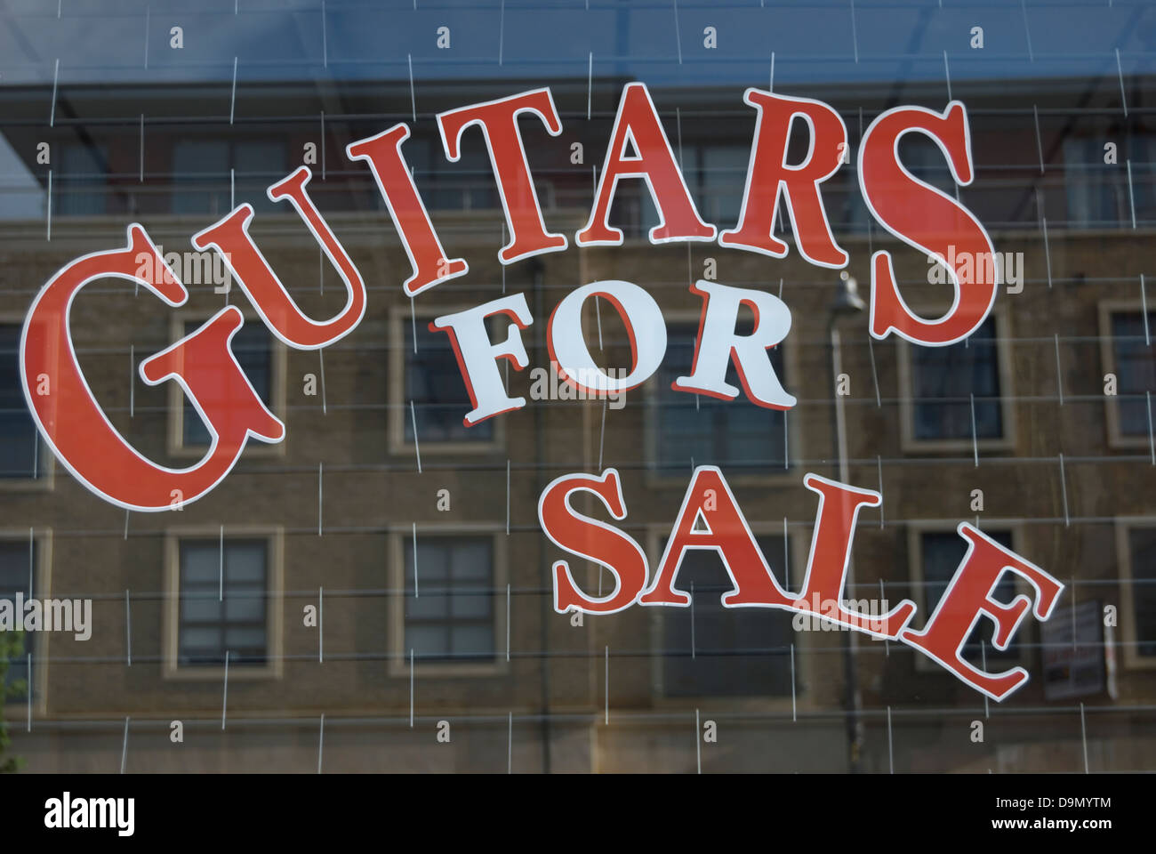 guitars for sale, music shop window in twickenham, middlesex, england Stock Photo