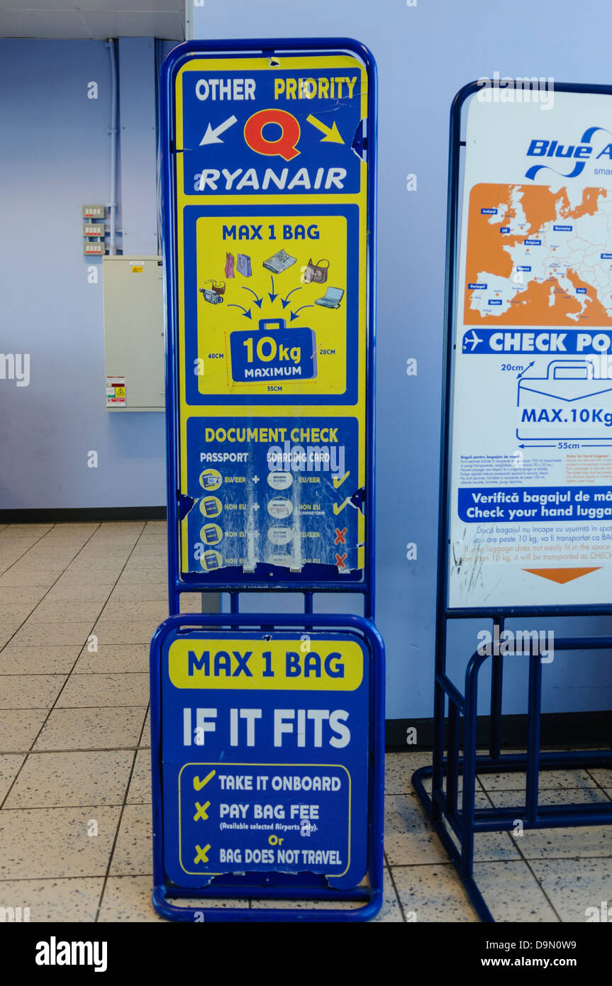 Ryanair bag size guide at the boarding gate in an airport Stock Photo