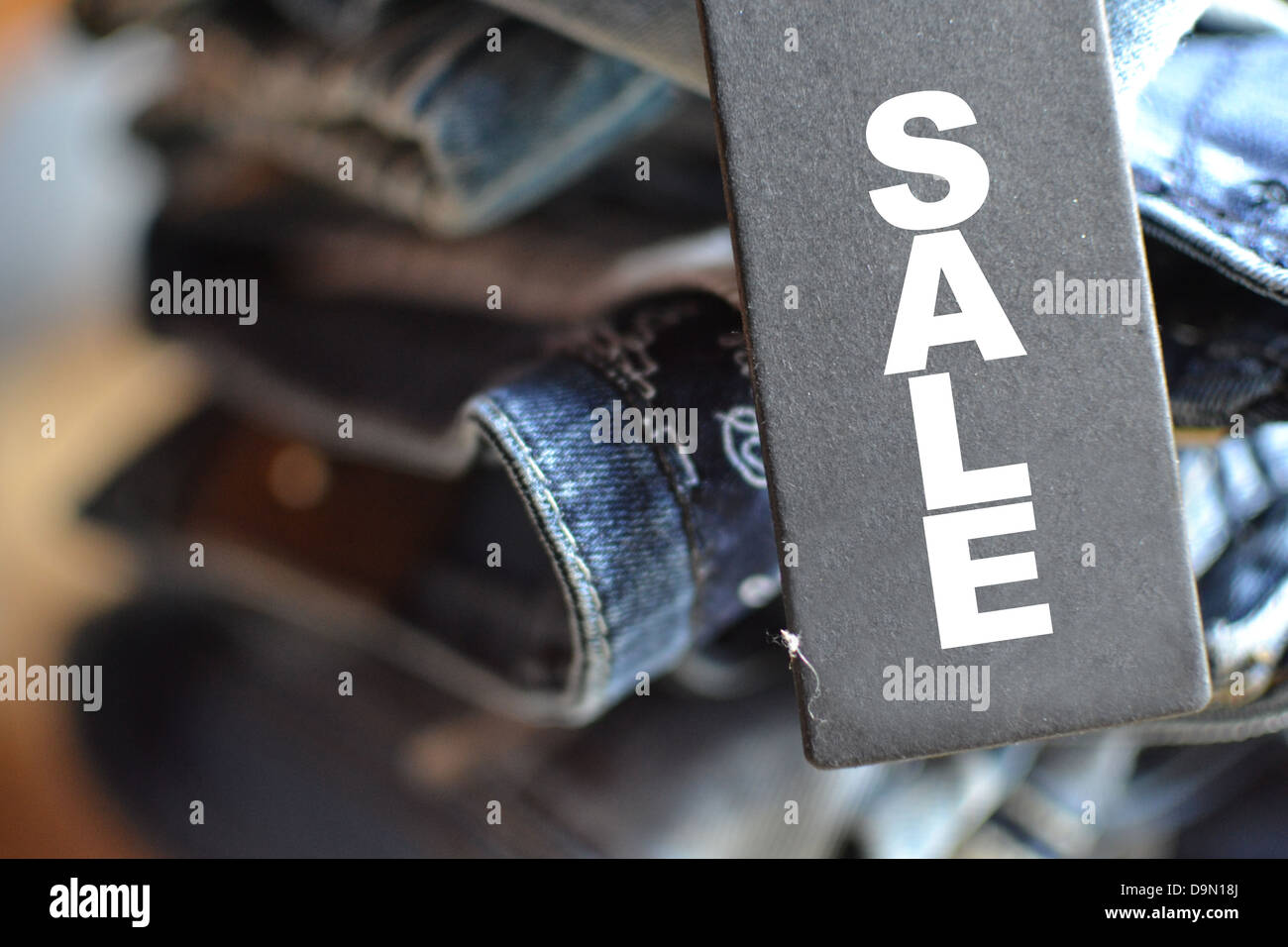 close up of jeans with sale tag Stock Photo