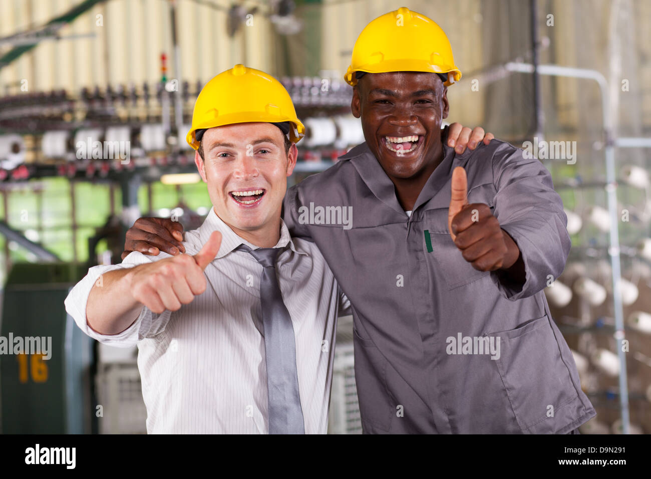 factory manager and worker thumbs up Stock Photo - Alamy