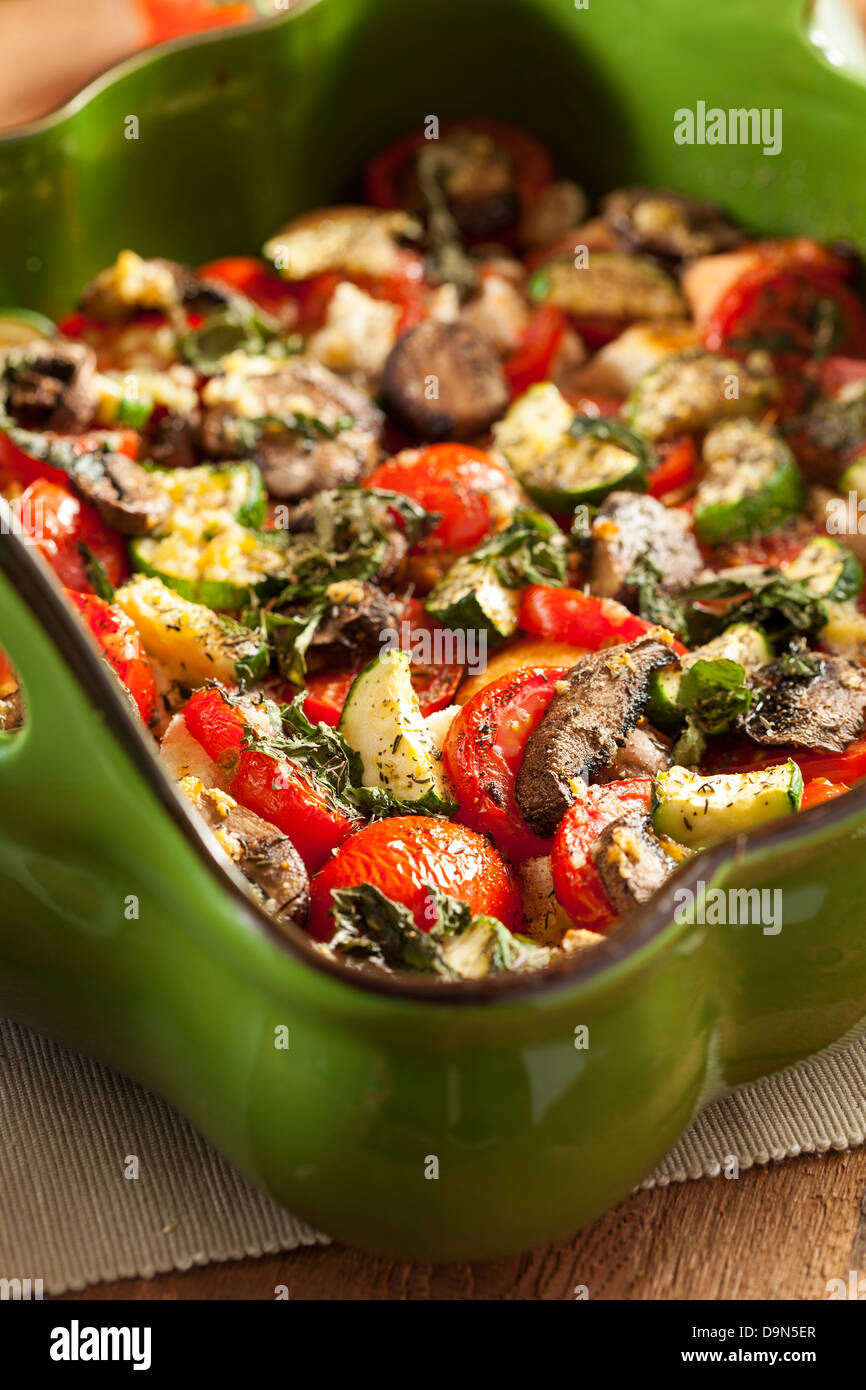 Homemade tomato bread gratin with basil and zucchini Stock Photo