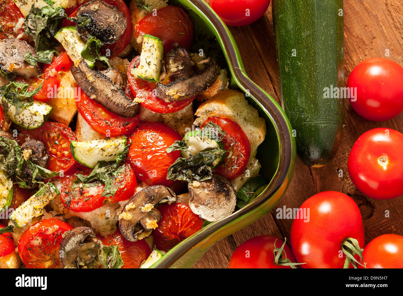 Homemade tomato bread gratin with basil and zucchini Stock Photo Alamy