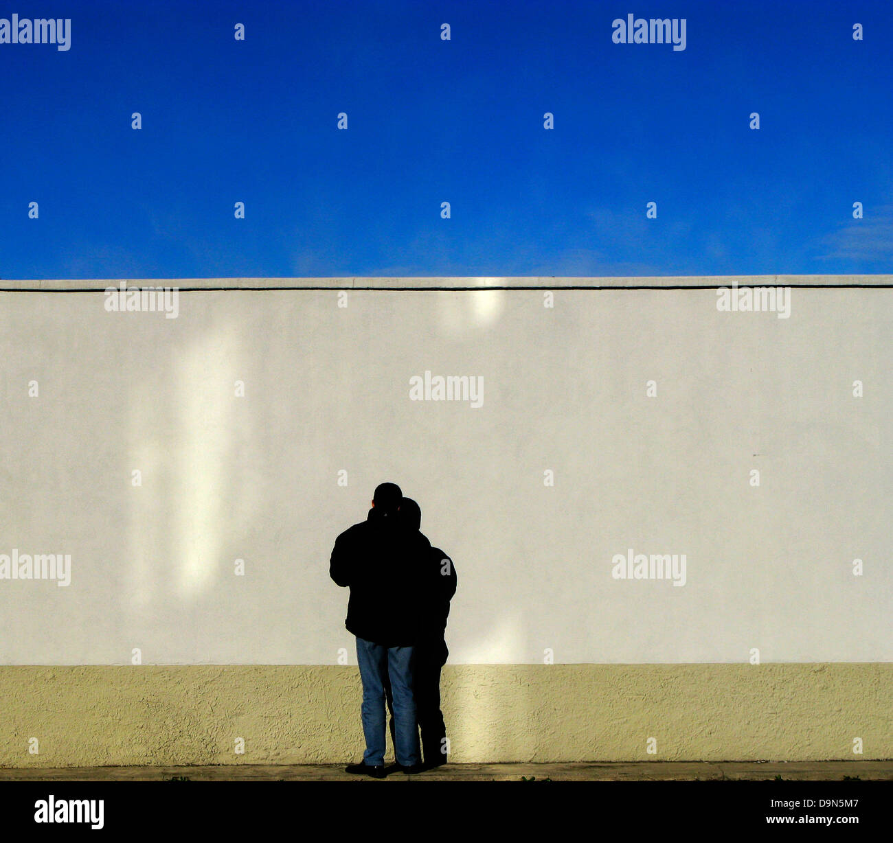 man in front of a white wall Stock Photo - Alamy