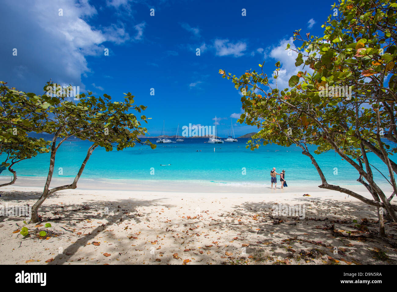 Couple walking on Honeymoon Beach on the Caribbean Island of St John in