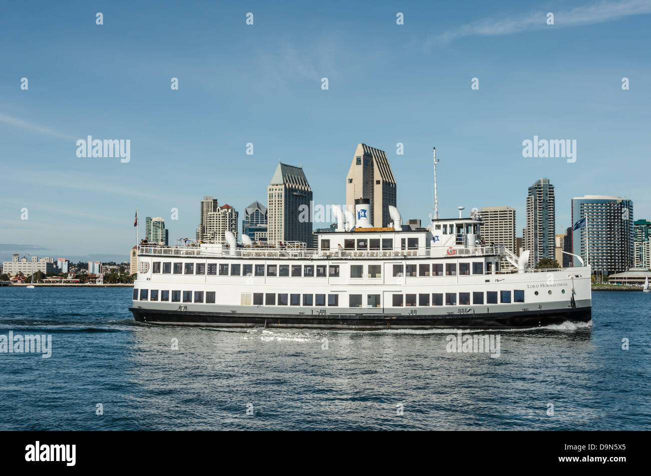 Tour boat on San Diego Harbor. San Diego Skyline in the background. Photographed from Coronado
