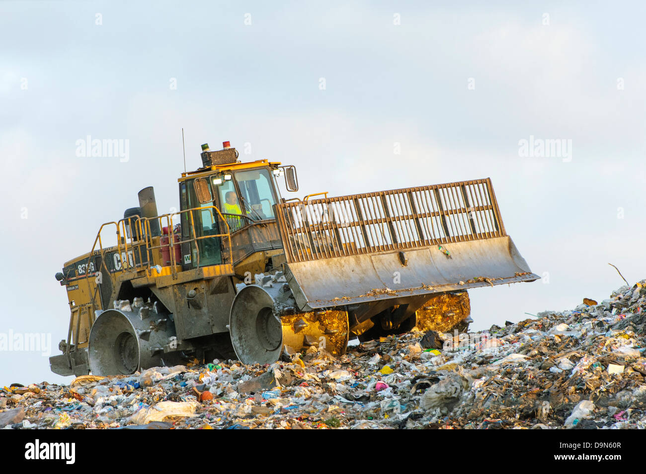 Heavy equipment compacting garbage at a sanitary landfill Stock Photo Alamy