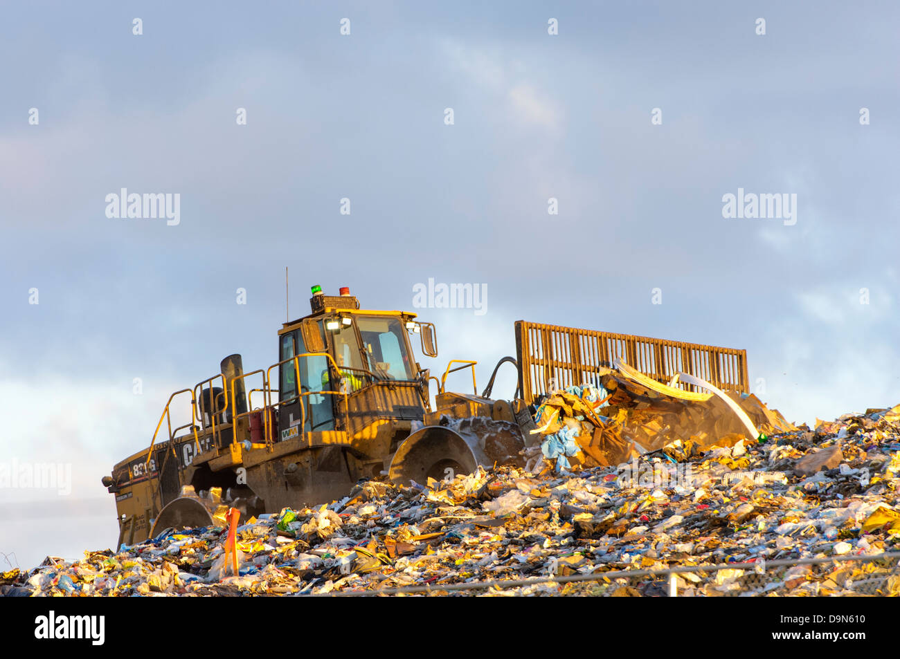 Heavy equipment pushing garbage at a sanitary landfill Stock Photo Alamy