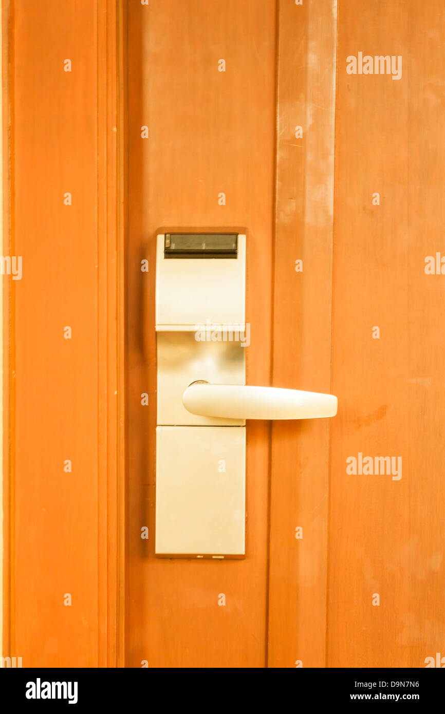 Hotel card lock handle on wood background Stock Photo