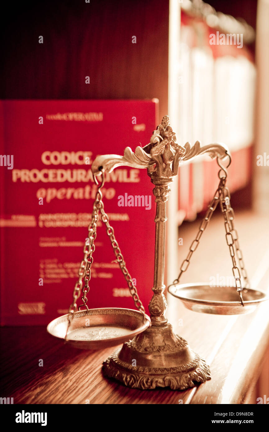 office criminal code and a scales of justice Stock Photo Alamy