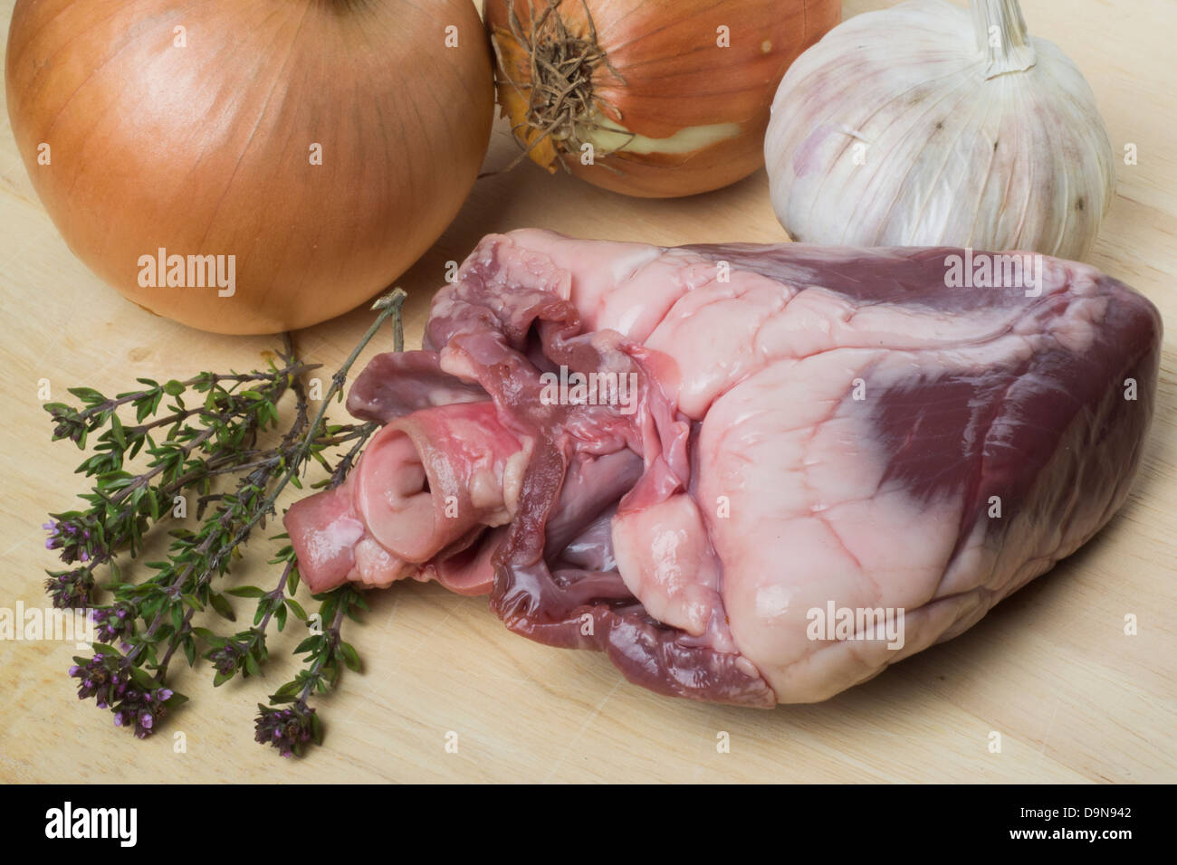 Lambs heart offal, onions and garlic Stock Photo