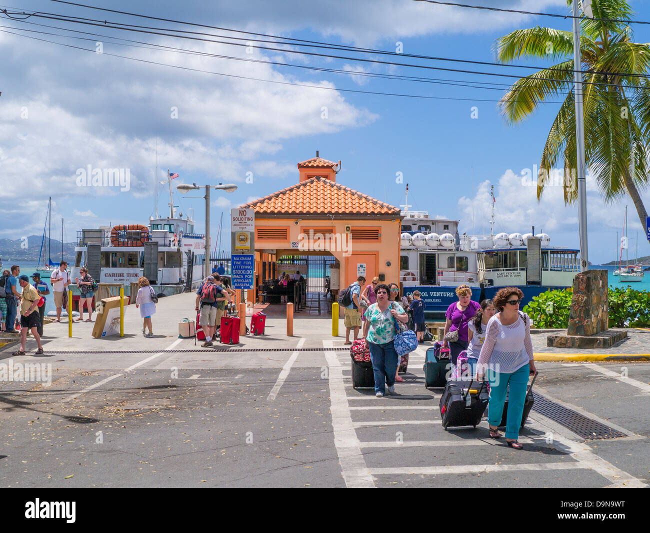 Tourists arriving from ferry in Cruz Bay on the Caribbean Island of St John in the US Virgin Islands Stock Photo