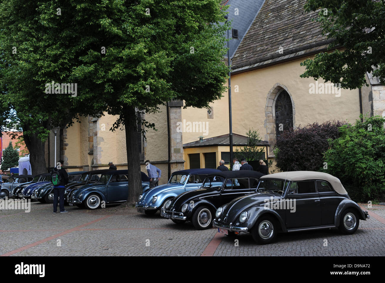 Hessisch Oldendorf, Germany. 23rd June, 2013. Volkswagen Beetle convertables are parked in the old town of Hessisch Oldendorf, Germany, 23 June 2013. Every four years, the Volkswagen Beetle Convention is held in Hessisch Oldendorf. Photo: PETER STEFFEN/dpa/Alamy Live News Stock Photo