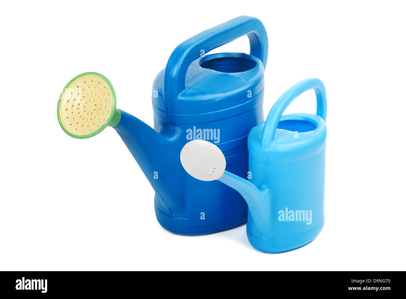 Two plastic watering cans isolated on a white background Stock Photo