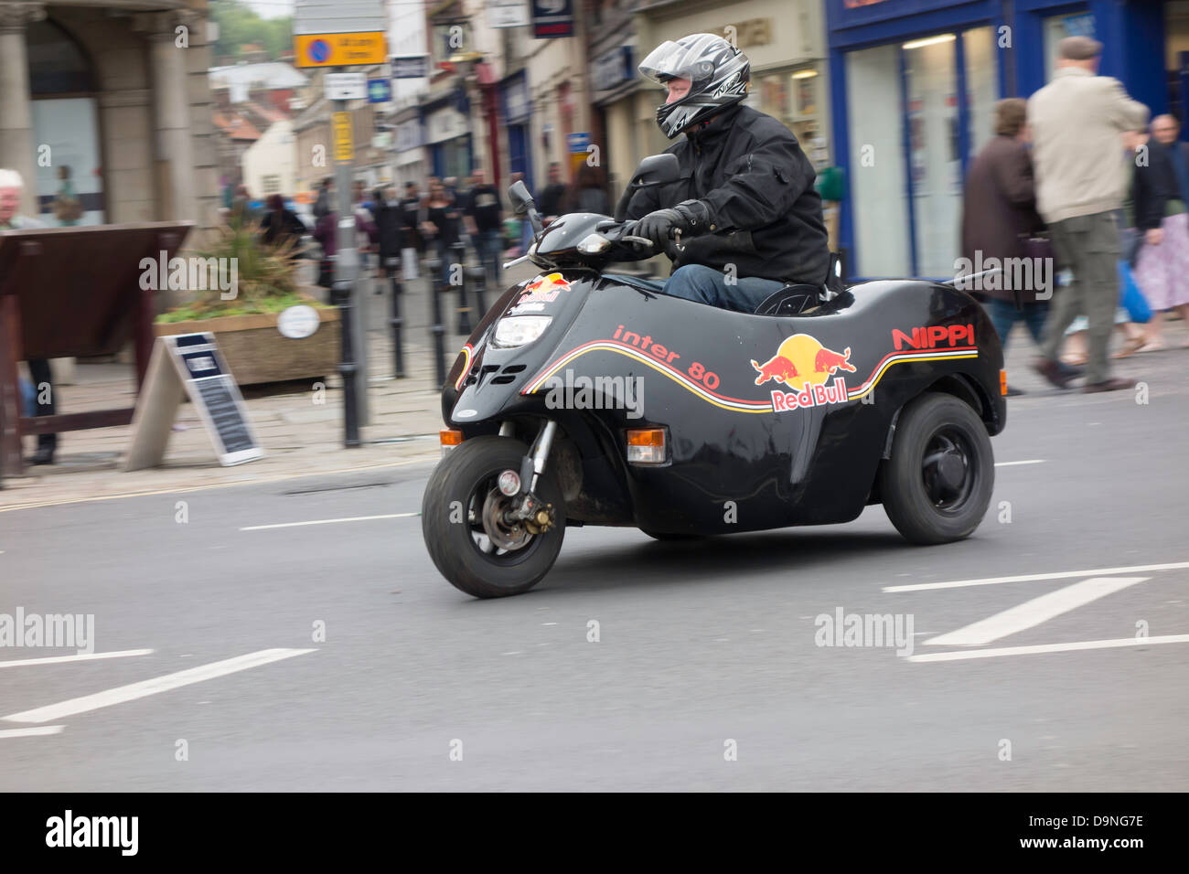 Disabled man riding a Nippi Inter 80 WAV or Wheelchair Accessible Vehicle Stock Photo