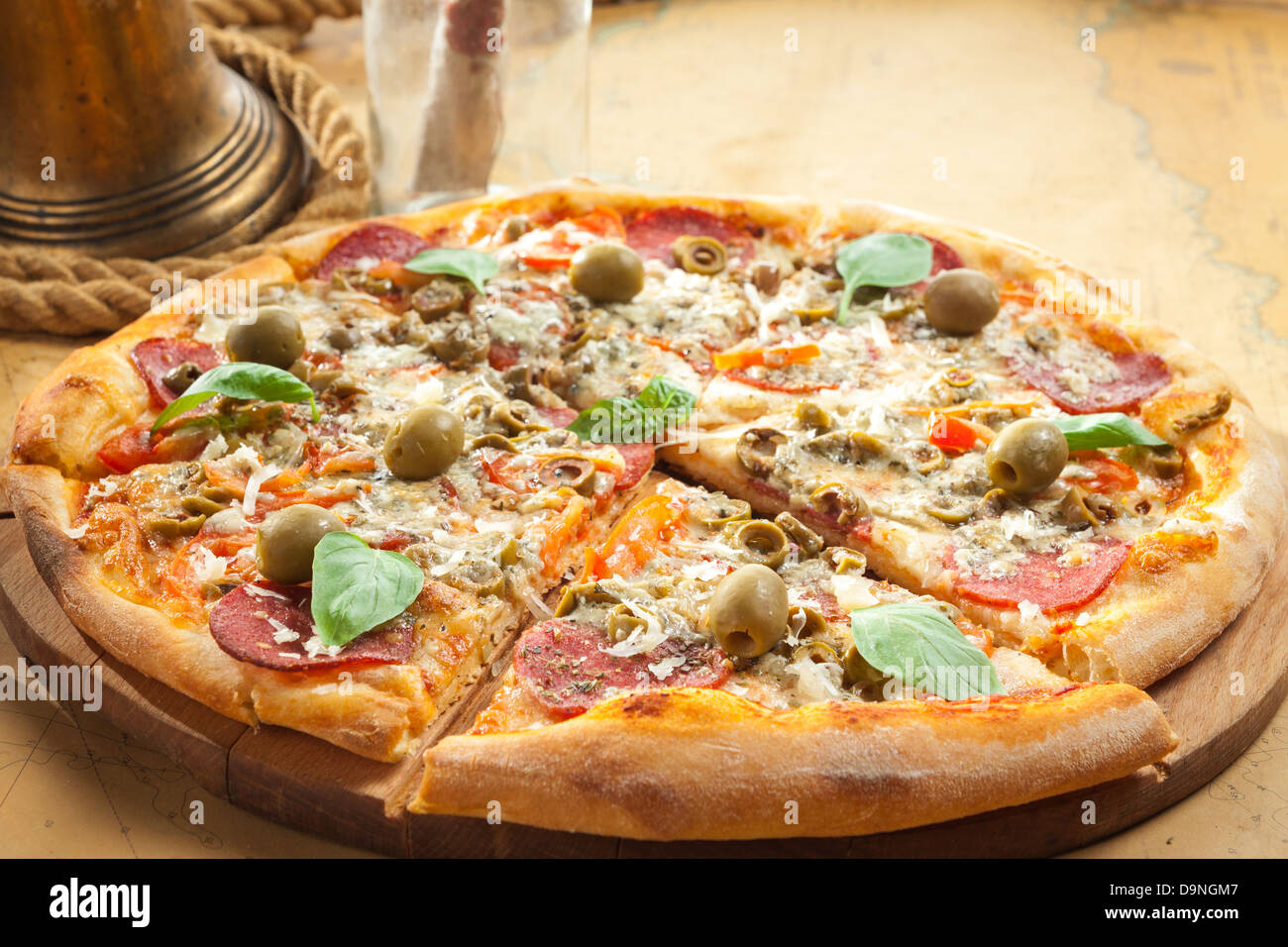 Sailor's pizza next to brass bell Stock Photo - Alamy