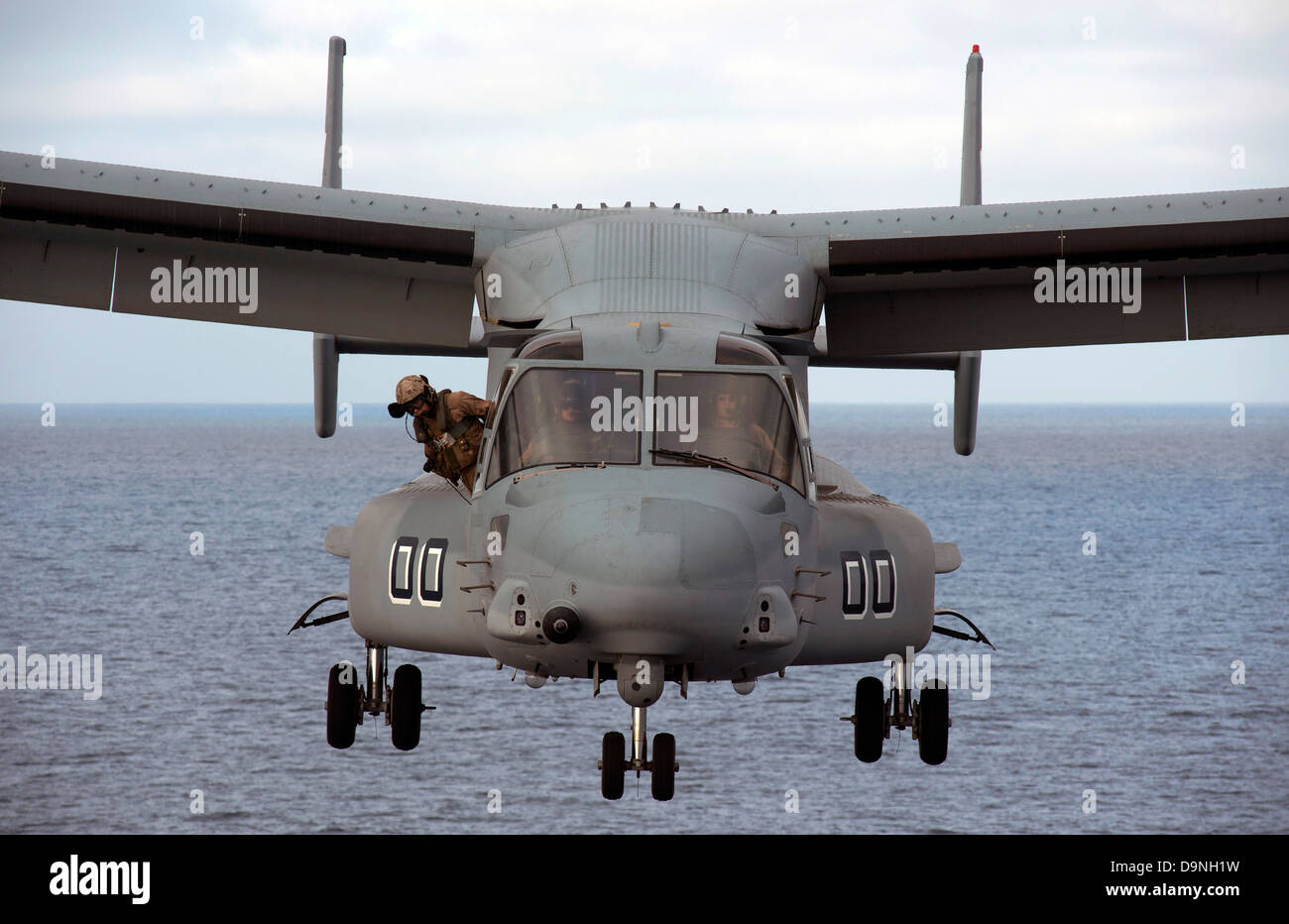 A US Marine Corps MV-22 Osprey tiltrotor aircraft approaches to land on the flight deck of the amphibious transport dock ship USS Anchorage April 22, 2013 in the Pacific Ocean. Stock Photo