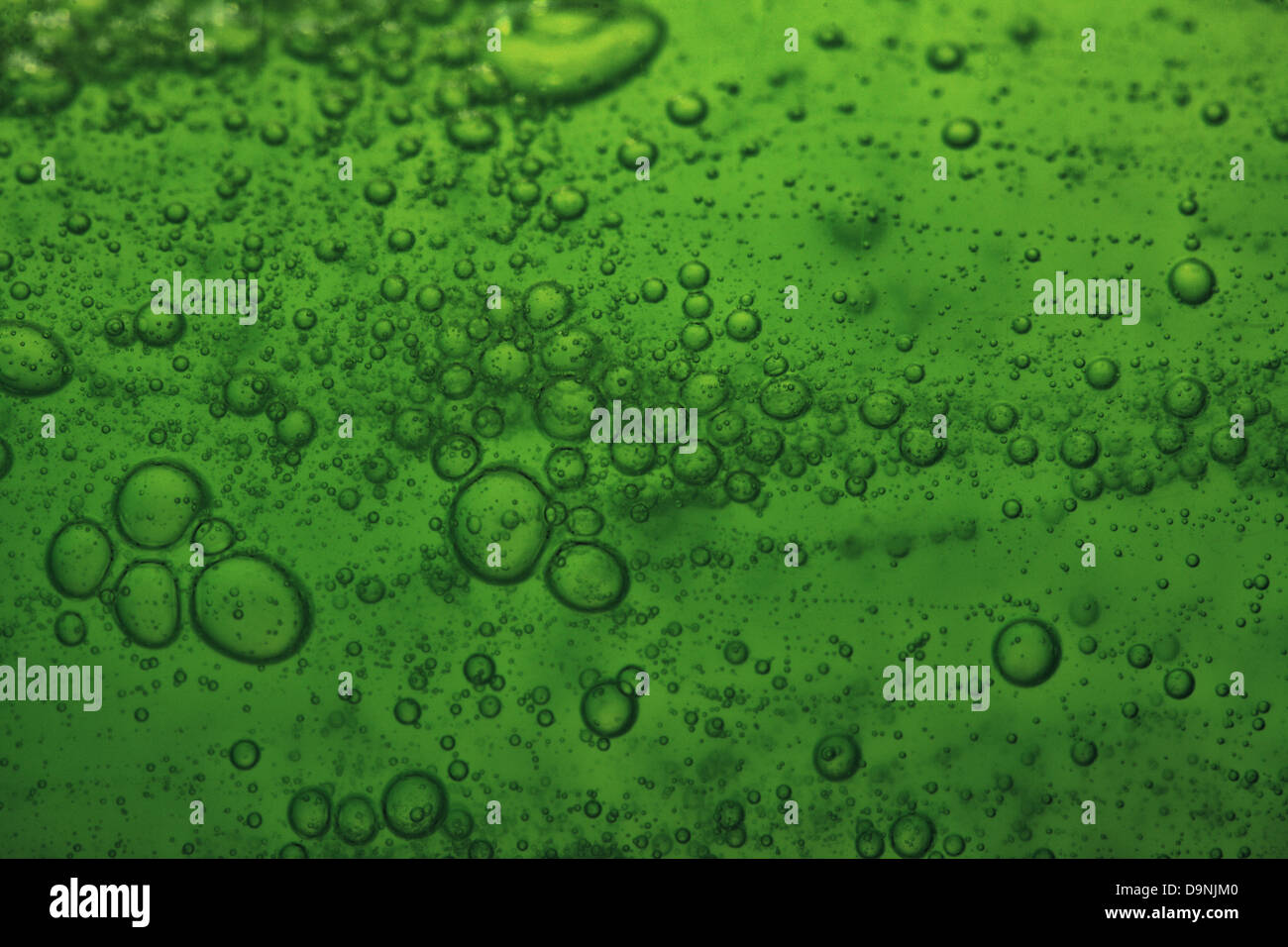 Green abstract blurred liquid background with soap bubbles Stock Photo ...