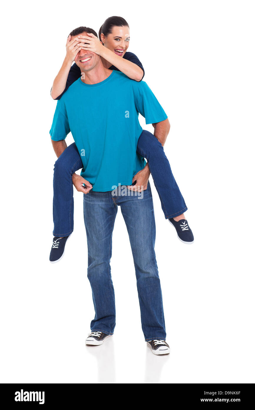 attractive young woman piggybacking on her boyfriend isolated on white background Stock Photo