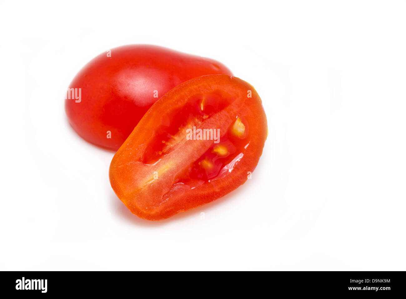 Grape or cherry tomatoes isolated on white background. Stock Photo