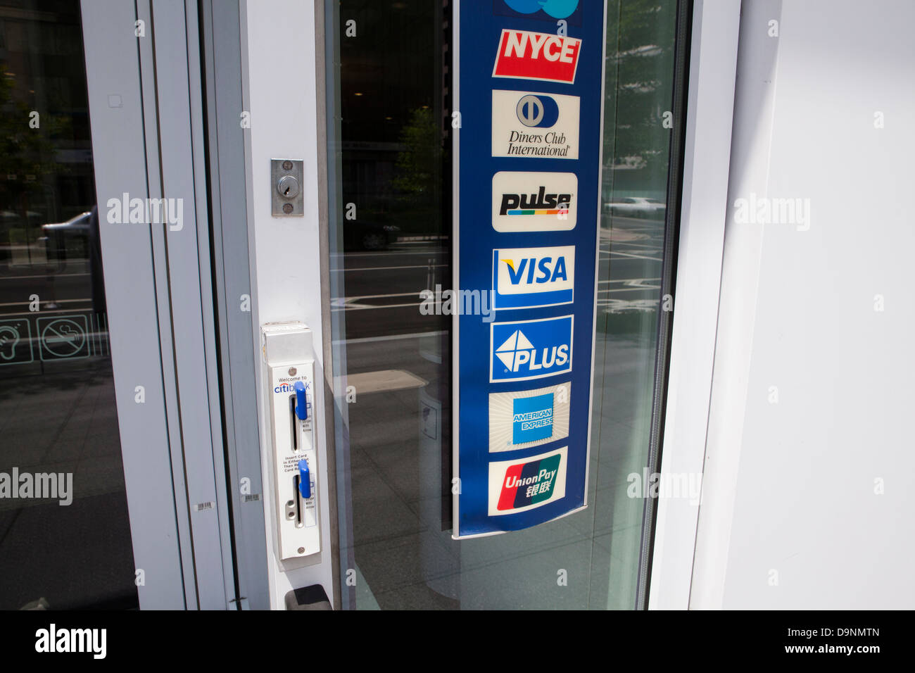 Multiple credit card brand label affixed to store entrance Stock Photo