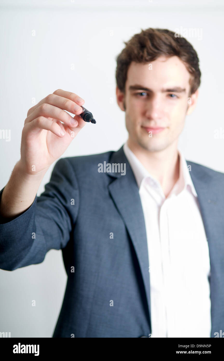 Professional young man writing with marker Stock Photo - Alamy