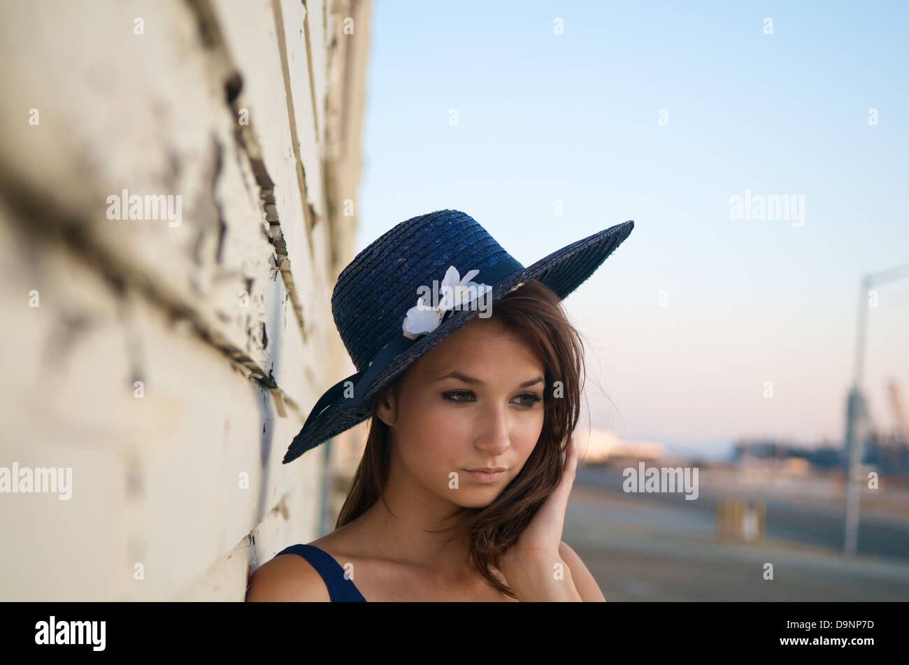 Portrait of beautiful caucasian model outdoor with a hat Stock Photo