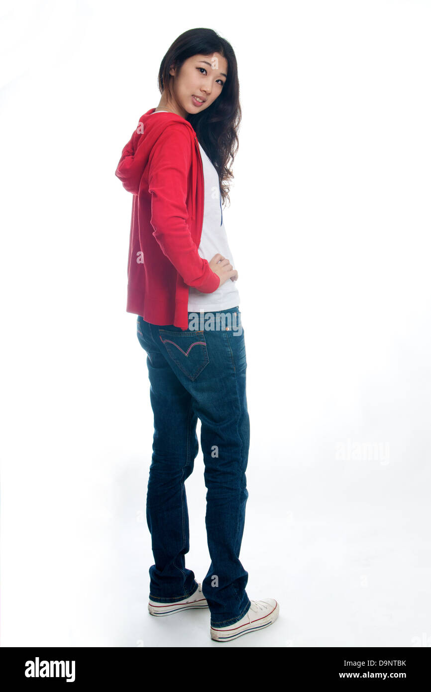 Portrait of beautiful Chinese girl in jeans and sweater Stock Photo