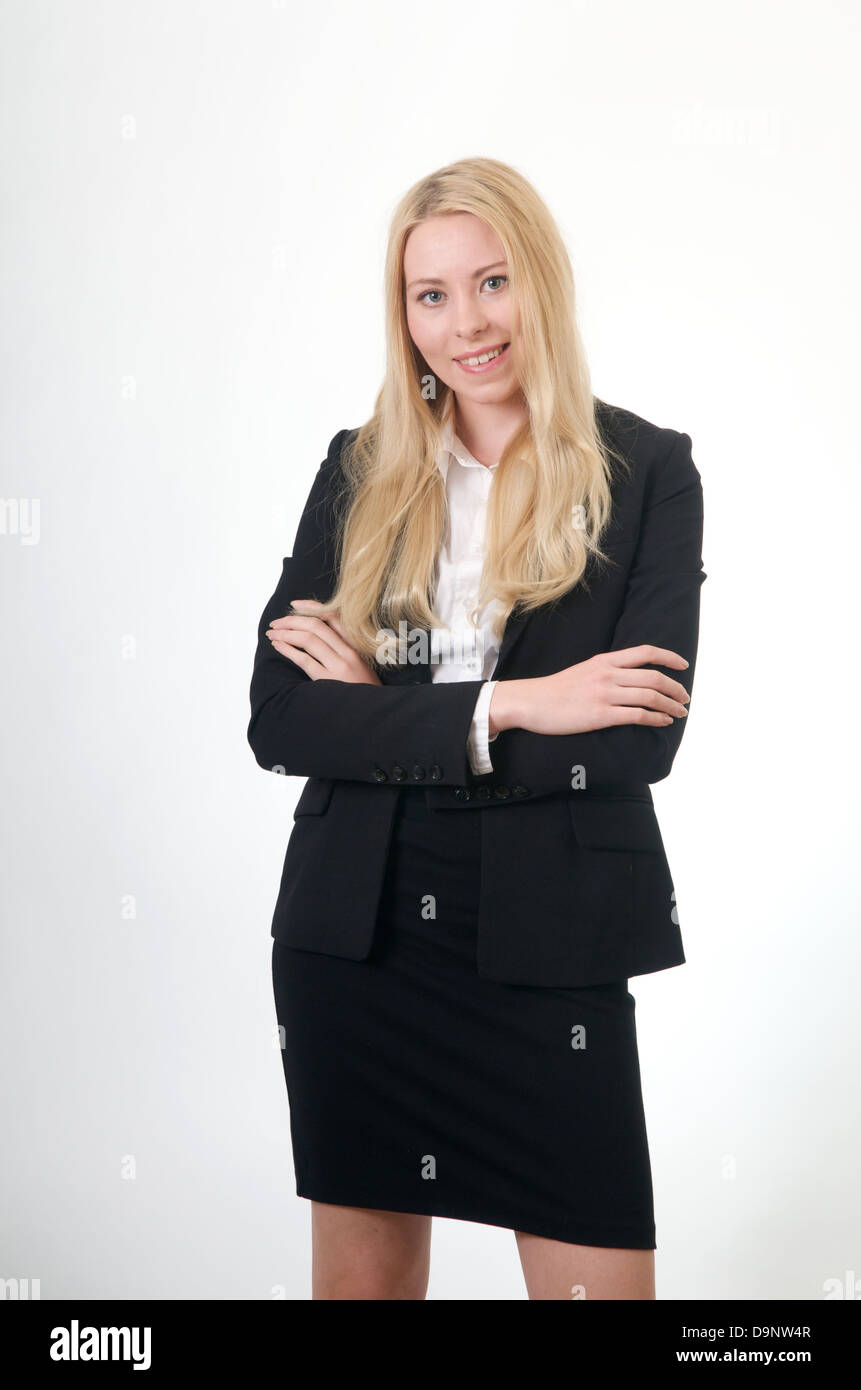 Young business woman arms crossed white background Stock Photo - Alamy