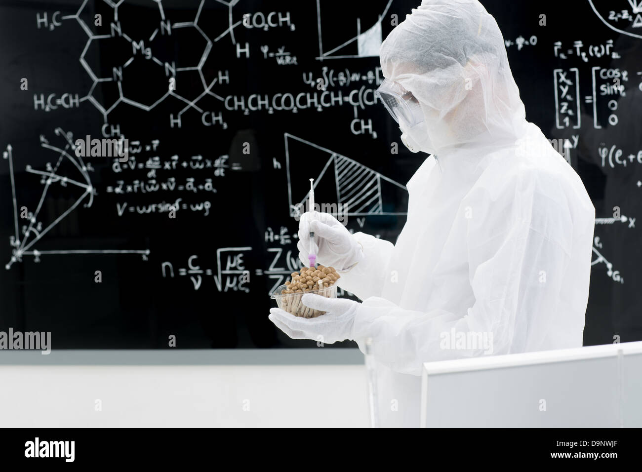 side view of a scientist in a laboratory testing and applying