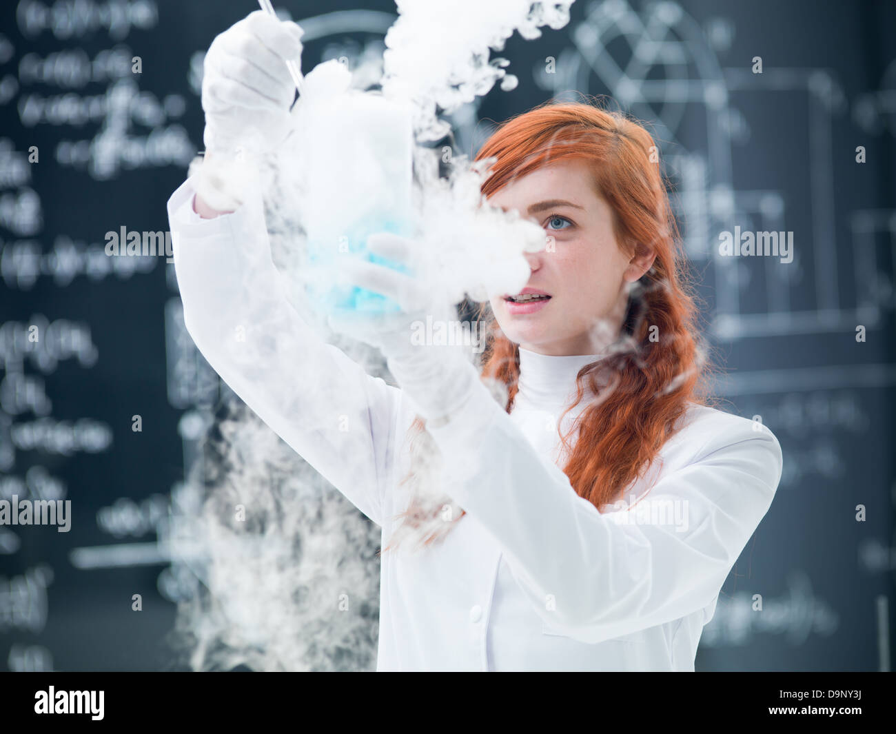 close-up of a student in a chemistry lab conducting an experiment with ...