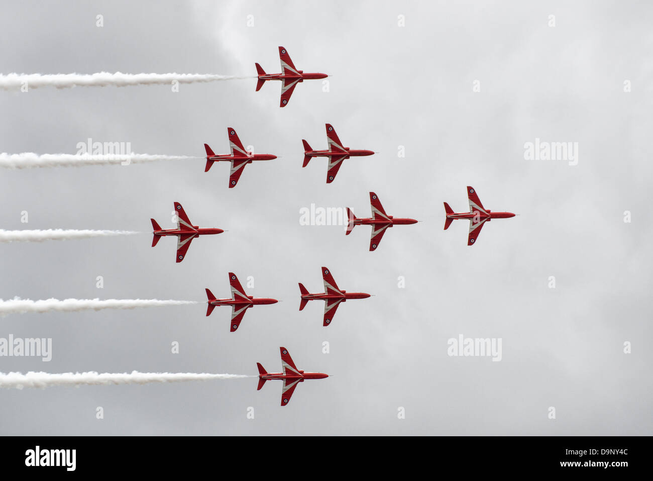 The Red Arrows fly in formation during their exciting aerobatic display at Weston Air Day Weston-Super-Mare. Stock Photo