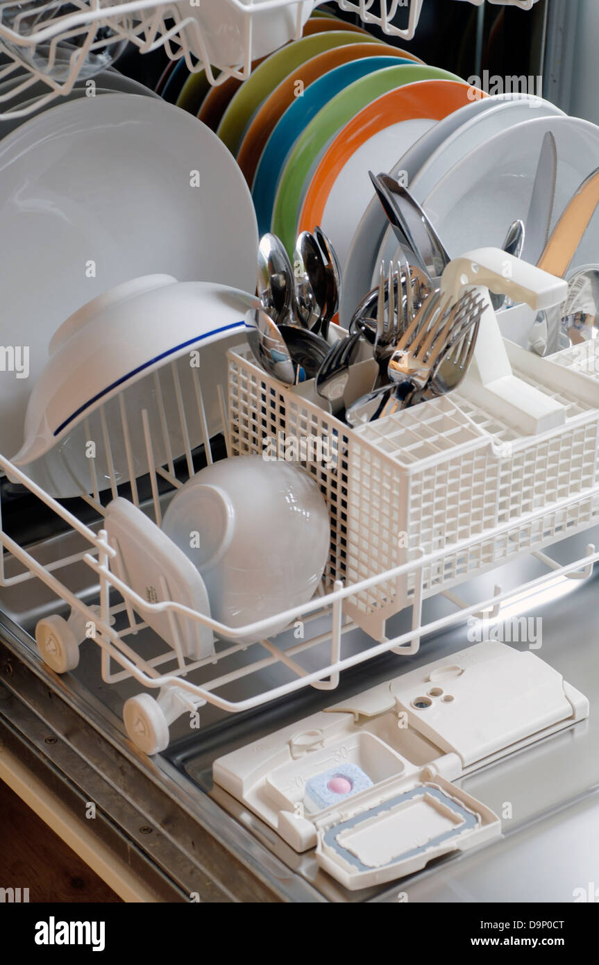 Crockery and cutlery in dishwasher Stock Photo Alamy