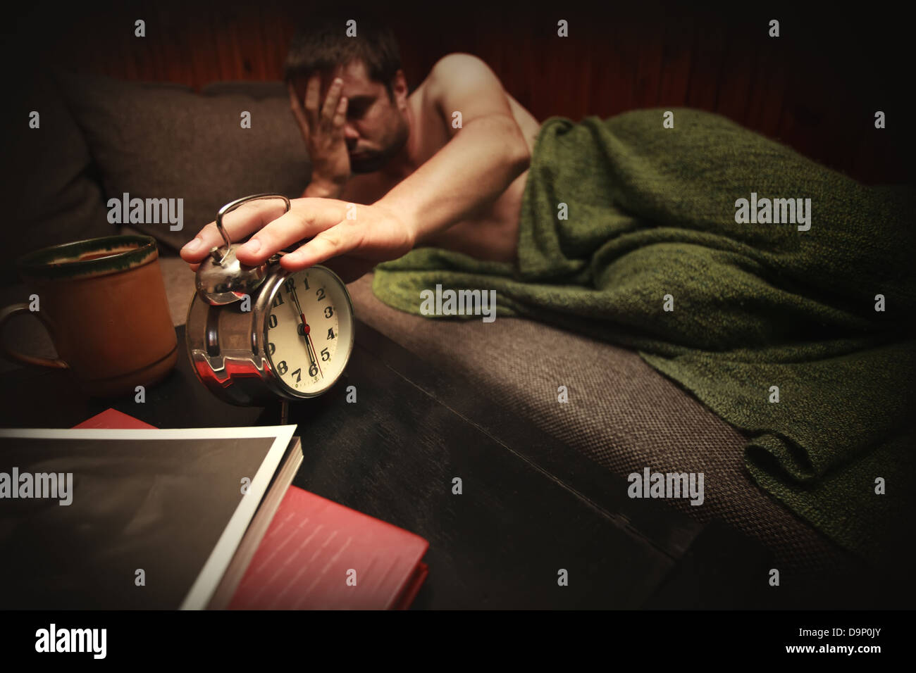 wake-up conceptual image with man and clock Stock Photo