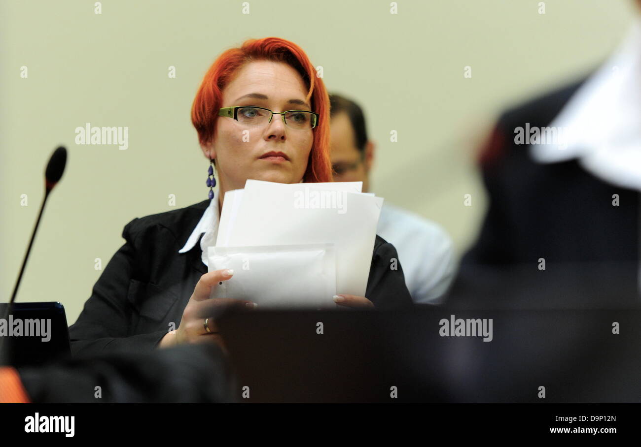 Nicole Schneiders, lawyer of the defendant Wohlleben, sitis inside the court room in Munich, Germany, 24 June 2013. The trial of the murders and terror attacks of German terror cell 'National Socialist Underground' (NSU) continues at the Higher Regional Court in Munich. The court has called witnesses. Photo: Tobias Hase Stock Photo