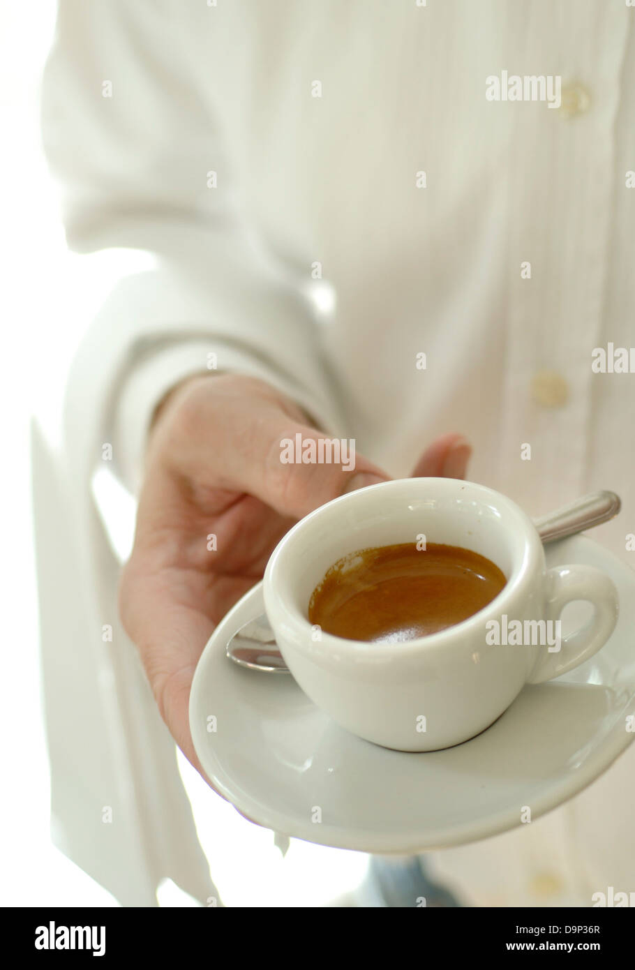 Waiter serving espresso Stock Photo Alamy