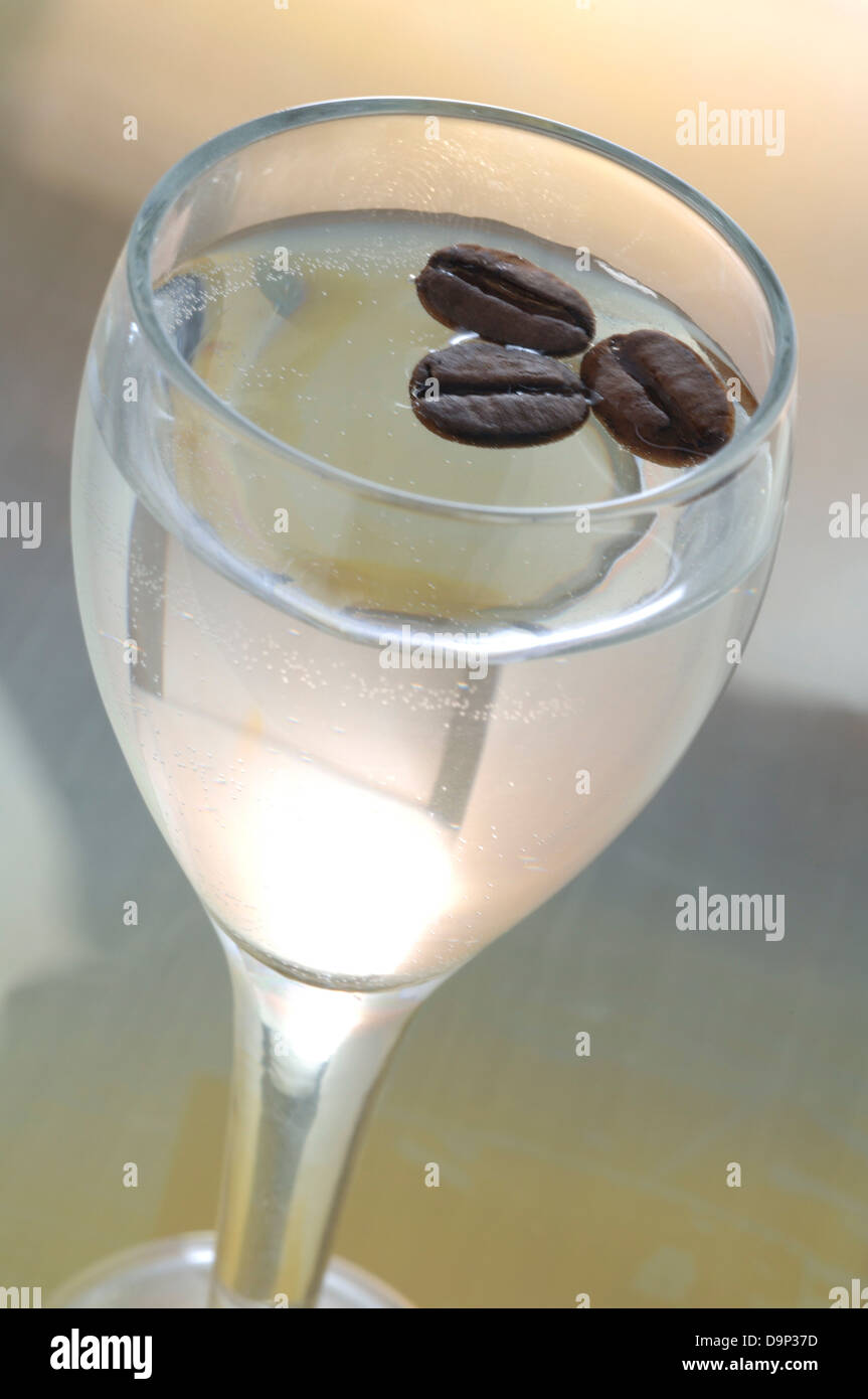 Sambuca with three coffee beans Stock Photo - Alamy