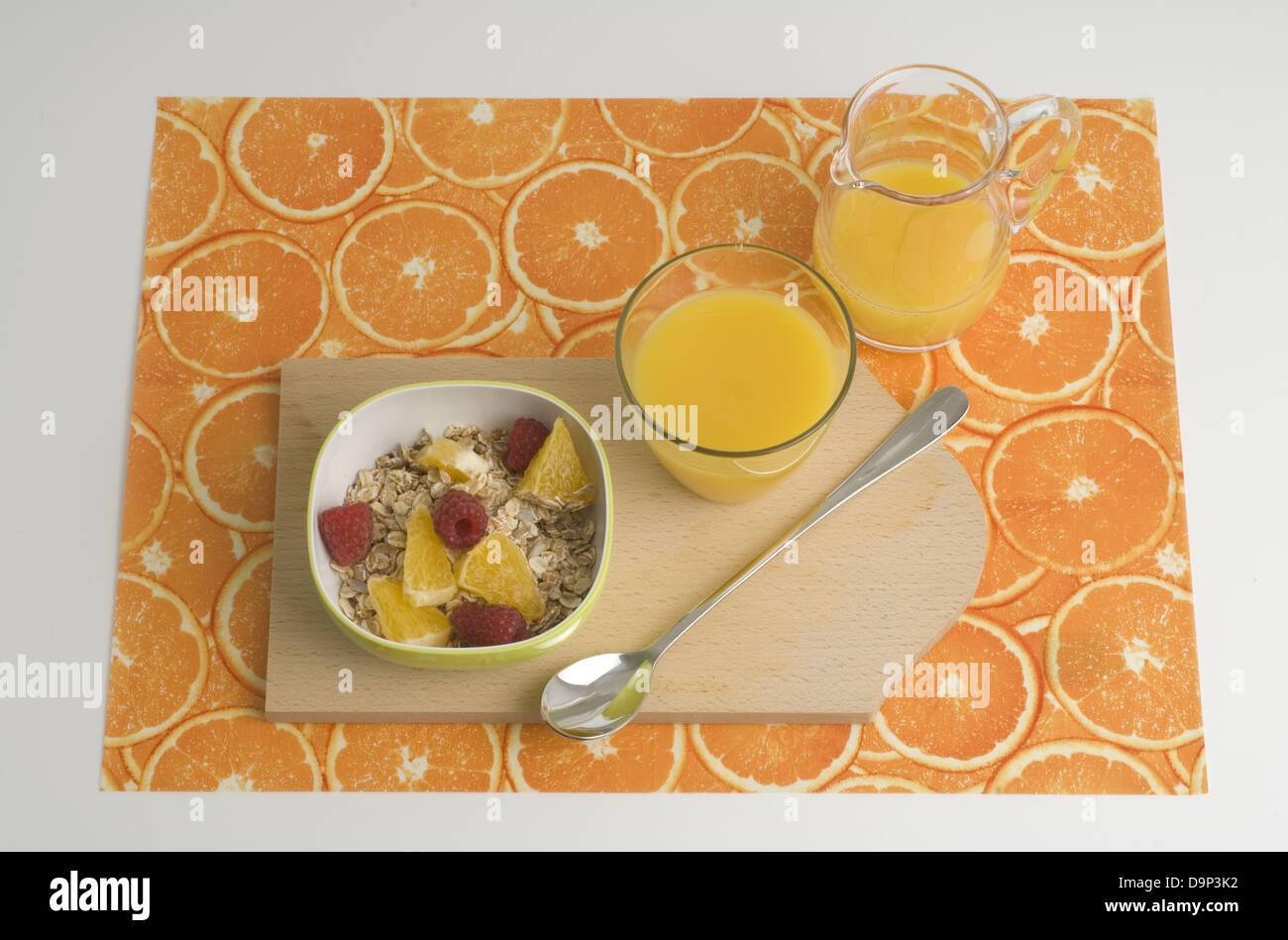 Muesli with fruit and orange juice Stock Photo Alamy