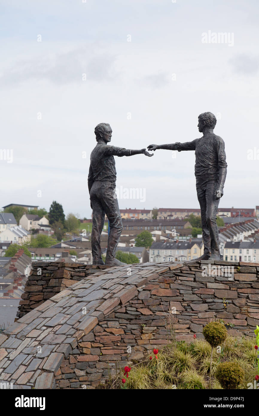 Hands across the divide bronze sculpture by Maurice Harron Derry