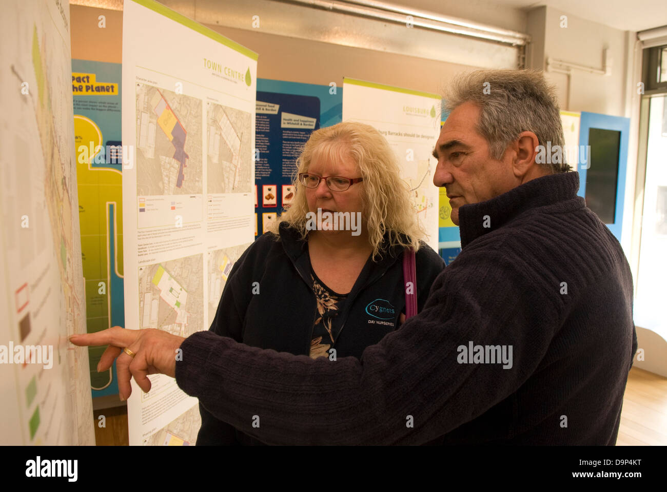 Local residents perusing plans for new eco town at Eco Station, Bordon, Hampshire, UK. Stock Photo