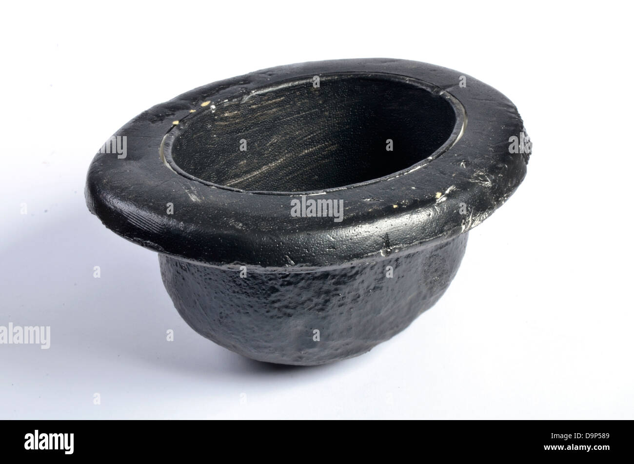 Copy of a black bowler hat, upturned. Stock Photo