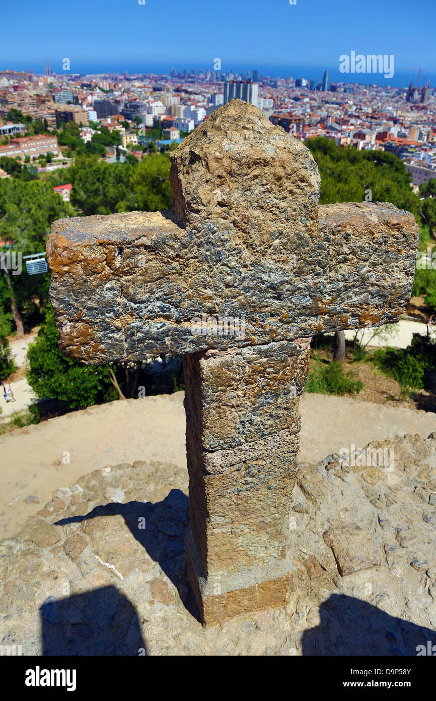 General view of the city skyline and a cross from Parc Guell park in Barcelona, Spain Stock Photo