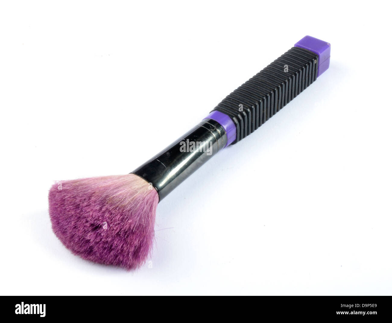 Black makeup brush with purple dusting Stock Photo Alamy