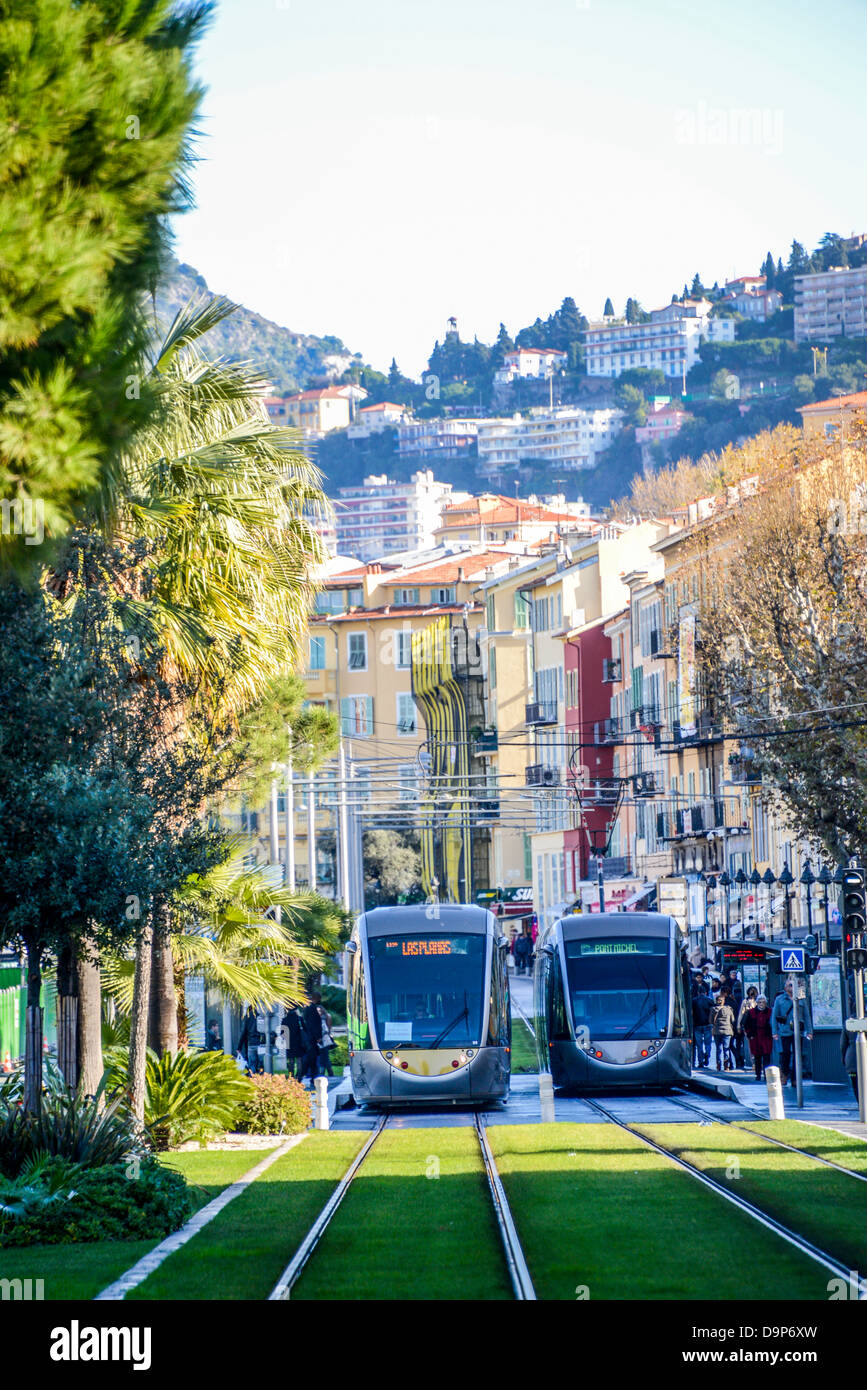 The new number 1 tram-line in Nice France riding on tracks with grass to soften the noice Stock Photo