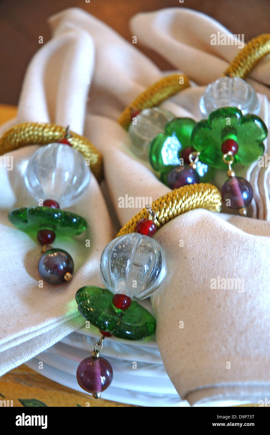 Napkins with ornate napkin rings Stock Photo Alamy